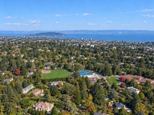 Aerial view of a luxury Hillsborough, California estate with reflecting pool and formal gardens